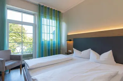 Ein Bett oder Betten in einem Zimmer der Unterkunft Hotel Avisa