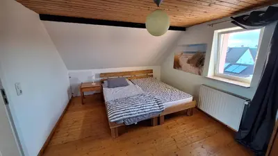 Ein Bett oder Betten in einem Zimmer der Unterkunft Cozy apartment with S-Bahn connection to Frankfurt