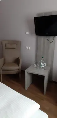 Ein Bett oder Betten in einem Zimmer der Unterkunft Zum Kronprinzen Hotel Garni