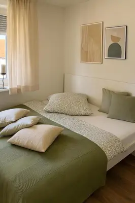 Ein Bett oder Betten in einem Zimmer der Unterkunft Schön Wohnen in St Leon Rot