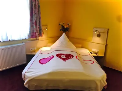 Ein Bett oder Betten in einem Zimmer der Unterkunft Dornröschen