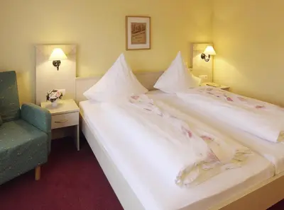 Ein Bett oder Betten in einem Zimmer der Unterkunft Dornröschen