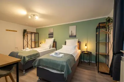 Ein Bett oder Betten in einem Zimmer der Unterkunft Übernachten im Kulturdenkmal - Weinort