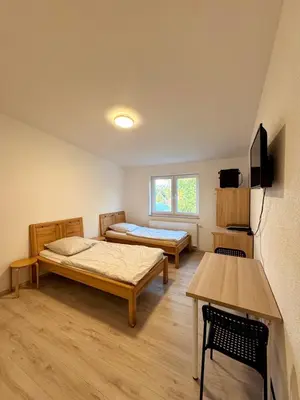 Ein Bett oder Betten in einem Zimmer der Unterkunft Muskat
