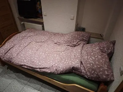 Ein Bett oder Betten in einem Zimmer der Unterkunft Gemütliche Einliegerwohnung im Herzen der Pfalz