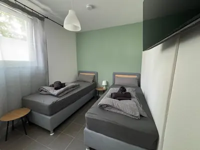 Ein Bett oder Betten in einem Zimmer der Unterkunft Amalfi A12 - 8 Betten - 4 Zimmer - neu renoviert!!
