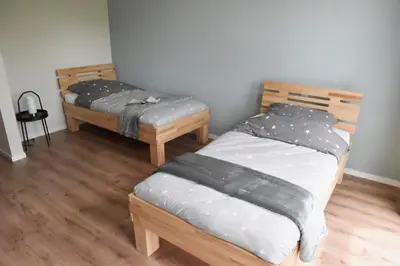 Ein Bett oder Betten in einem Zimmer der Unterkunft Sonnenscheinhaus Wohnung 2