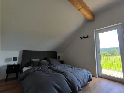Ein Bett oder Betten in einem Zimmer der Unterkunft Ferienwohnung in absoluter Randlage