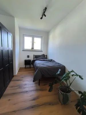 Ein Bett oder Betten in einem Zimmer der Unterkunft Ferienwohnung in absoluter Randlage