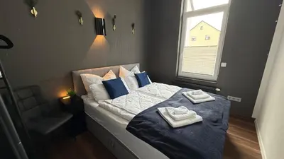 Ein Bett oder Betten in einem Zimmer der Unterkunft Kings und Queens - 2SZ - Whirlpool - Terrasse - Grill