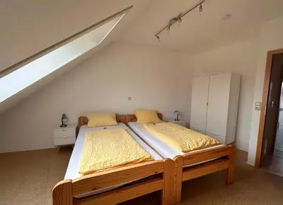 Ein Bett oder Betten in einem Zimmer der Unterkunft Gästehaus Im Unnerdorf