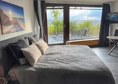 Ein Bett oder Betten in einem Zimmer der Unterkunft Penthouse Apartment Zentral mit Goldstadtblick