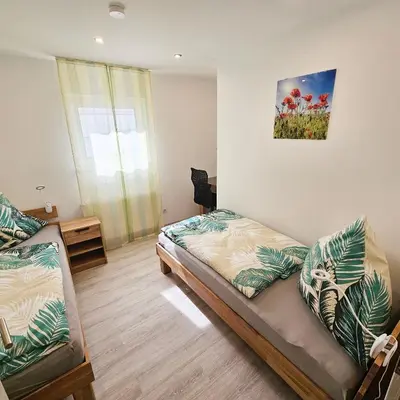 Ein Bett oder Betten in einem Zimmer der Unterkunft Ferienwohnung Popp Langen