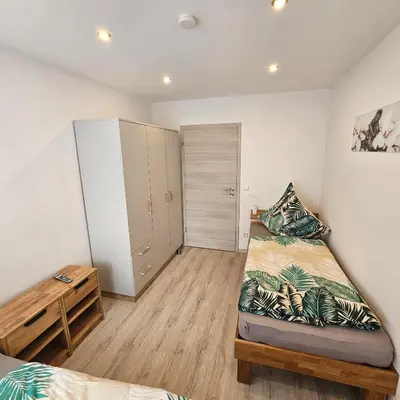 Ein Bett oder Betten in einem Zimmer der Unterkunft Ferienwohnung Popp Langen
