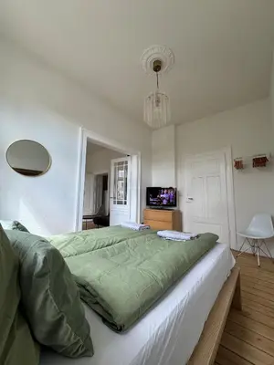 Ein Bett oder Betten in einem Zimmer der Unterkunft Grand Apartment Worms - Stilvolles Wohnen im Zentrum
