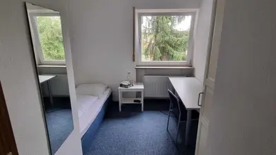 Ein Bett oder Betten in einem Zimmer der Unterkunft Hotel 3H Mannheim