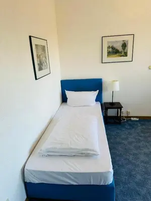Ein Bett oder Betten in einem Zimmer der Unterkunft Hotel 3H Mannheim