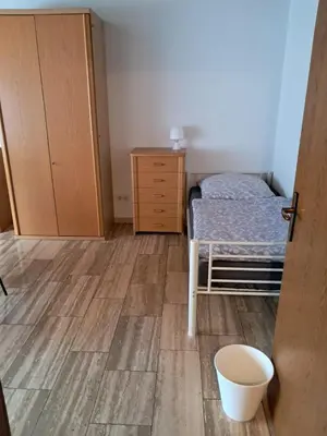 Ein Bett oder Betten in einem Zimmer der Unterkunft Haus mit zwei Ferienwohnungen