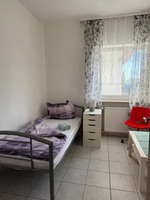 Ein Bett oder Betten in einem Zimmer der Unterkunft Sonnenblick Kleiberweg