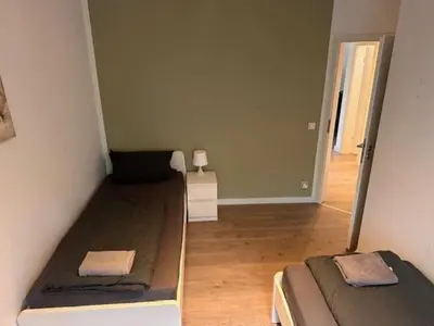 Ein Bett oder Betten in einem Zimmer der Unterkunft 3 Schlafzimmer Wohnung für 6 Personen in Wörrstadt inkl Terrasse & Garten