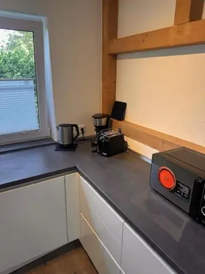 Küche/Küchenzeile in der Unterkunft 3 Schlafzimmer Wohnung für 6 Personen in Wörrstadt inkl Terrasse & Garten