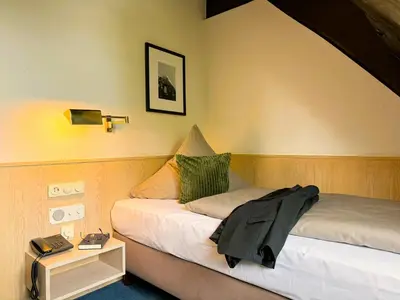 Ein Bett oder Betten in einem Zimmer der Unterkunft Herzogskelter Hotel & Restaurant