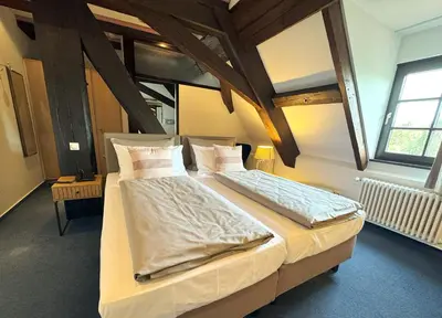 Ein Bett oder Betten in einem Zimmer der Unterkunft Herzogskelter Hotel & Restaurant