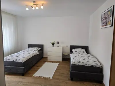 Ein Bett oder Betten in einem Zimmer der Unterkunft Moderne großzügige Wohnung zu vermieten