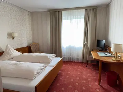 Ein Bett oder Betten in einem Zimmer der Unterkunft ChesaMia Hotel u Appartment