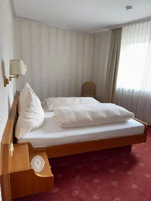 Ein Bett oder Betten in einem Zimmer der Unterkunft ChesaMia Hotel u Appartment