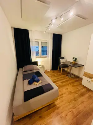 Ein Bett oder Betten in einem Zimmer der Unterkunft Alte Zimmerei