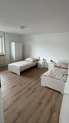 Ein Bett oder Betten in einem Zimmer der Unterkunft Monteurwohnung und Ferienwohnung Mannheim