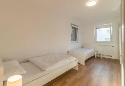 Ein Bett oder Betten in einem Zimmer der Unterkunft Haus Zehnfreunde