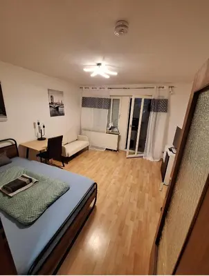 Ein Bett oder Betten in einem Zimmer der Unterkunft Kleines Appartement mit Terasse