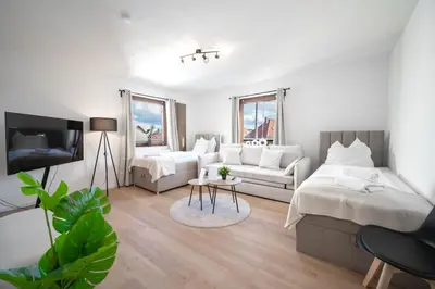 Ein Bett oder Betten in einem Zimmer der Unterkunft Malu Rooms - Attraktive Lage, Balkon, SmartTv, 24h Checkin, Waschmaschine,