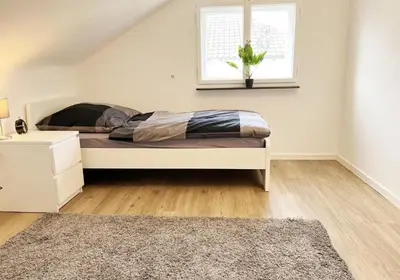 Ein Bett oder Betten in einem Zimmer der Unterkunft City Rooms Heppenheim