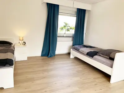 Ein Bett oder Betten in einem Zimmer der Unterkunft City Rooms Heppenheim