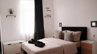 Ein Bett oder Betten in einem Zimmer der Unterkunft Ferienwohnung - schönes Heim Li-Apartments