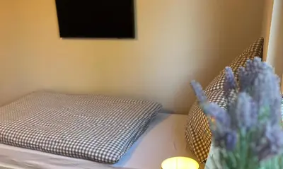 Ein Bett oder Betten in einem Zimmer der Unterkunft Ferienwohnung Talblick