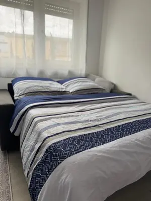 Ein Bett oder Betten in einem Zimmer der Unterkunft Petite Belle