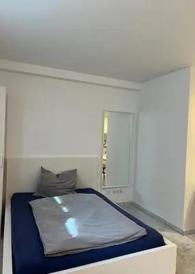 Ein Bett oder Betten in einem Zimmer der Unterkunft Moderne Souterrainwohnung