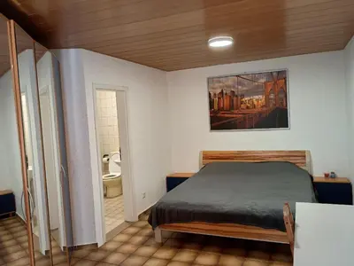 Ein Bett oder Betten in einem Zimmer der Unterkunft Gästezimmer-Dieburg