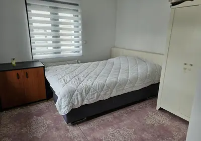 Ein Bett oder Betten in einem Zimmer der Unterkunft Kilicer Apartments