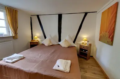Ein Bett oder Betten in einem Zimmer der Unterkunft Hotel Kleine Radlerherberge