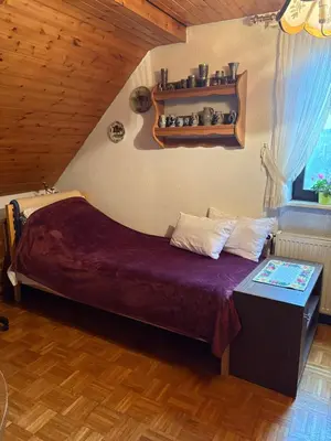 Ein Bett oder Betten in einem Zimmer der Unterkunft Ferienwohnung Jägerhaus