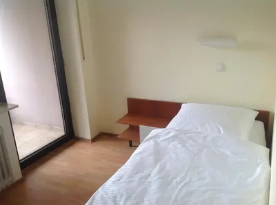 Ein Bett oder Betten in einem Zimmer der Unterkunft Hotel-Pension Schlossgarten