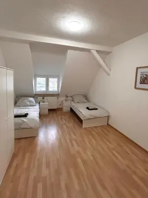 Ein Bett oder Betten in einem Zimmer der Unterkunft Monteurs- und Ferienwohnung Miltenberg