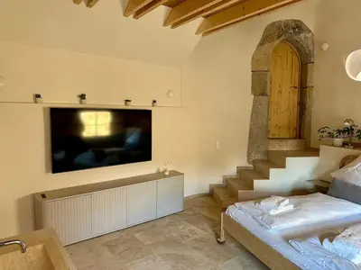 Ein Bett oder Betten in einem Zimmer der Unterkunft Eisenturm - Stadthaus, Turmgewölbe