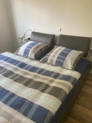 Ein Bett oder Betten in einem Zimmer der Unterkunft Ferienwohnung in Erlenbach