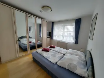 Ein Bett oder Betten in einem Zimmer der Unterkunft Ferienwohnung Karlsruhe